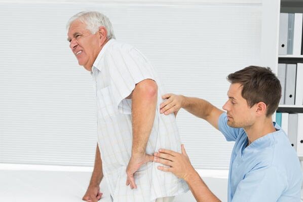 An elderly patient with low back pain at the doctor